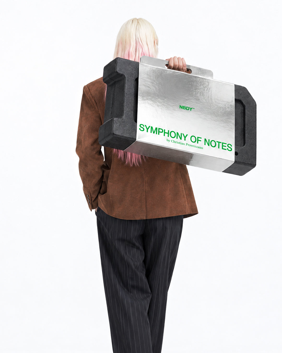 Model holding the Symphony of Notes Block case up to her face