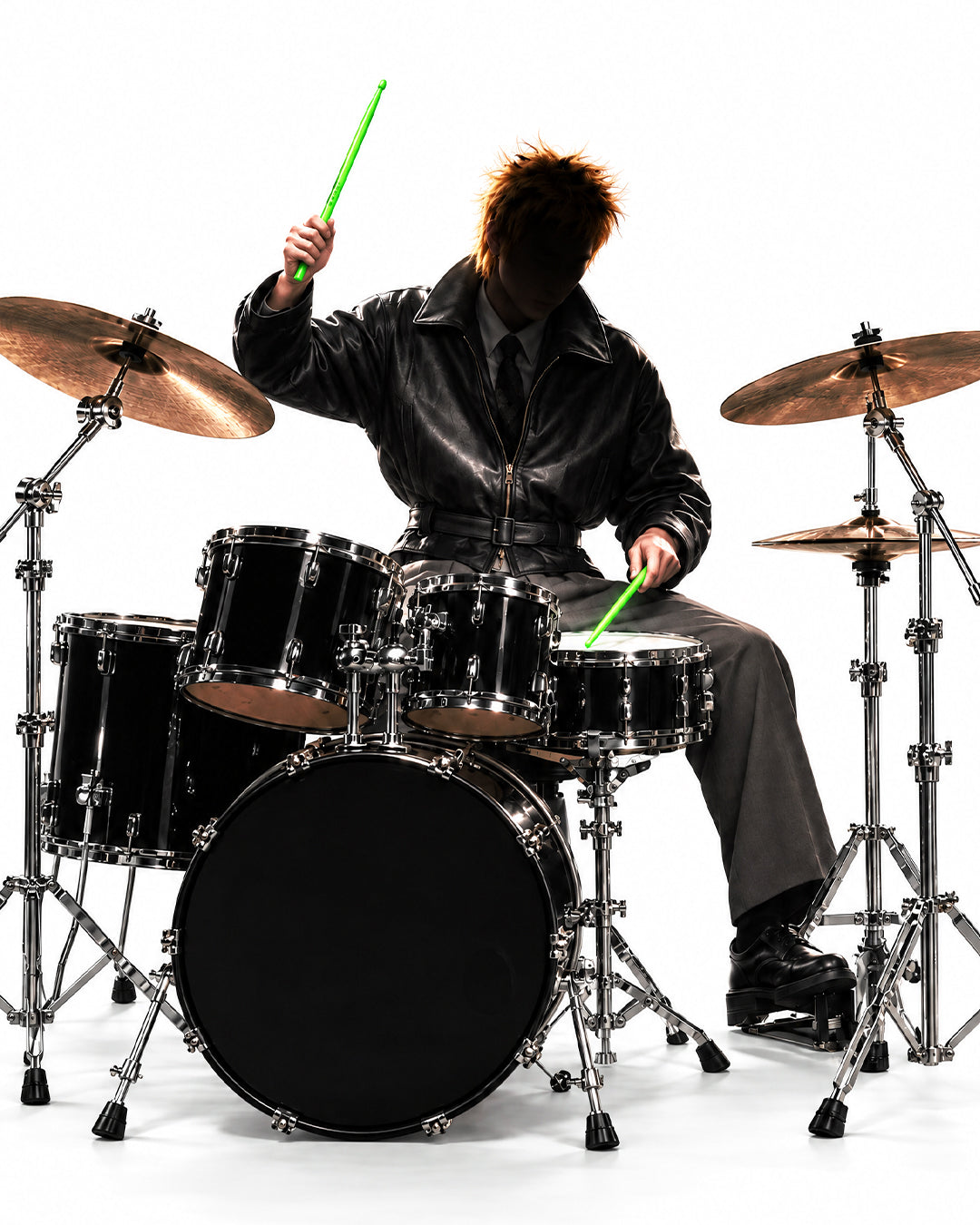 Model playing a drum kit with NBDY drumsticks